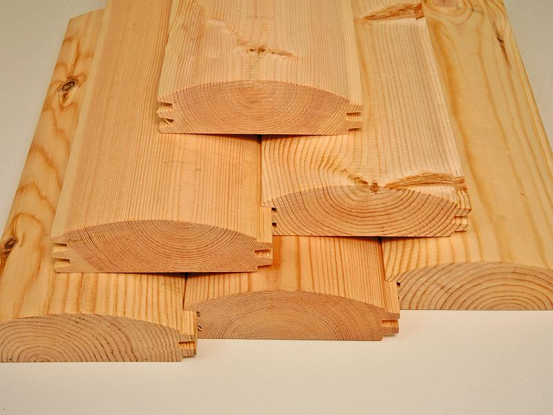 Wolff Finnhaus Grillkota Basic 9 mit Grillanlage schwarze Schindeln und rundem Tisch